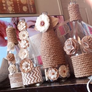 Four handcrafted wine bottles. Never been used. Can customize!